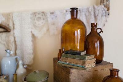 Books and container on table at home