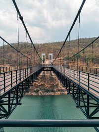 Bridge over footbridge against sky