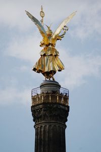 Low angle view of statue of liberty against sky