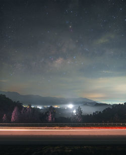 Scenic view of field against sky at night