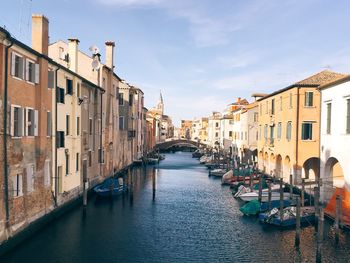 Boats moored in canal