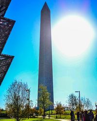 Low angle view of skyscrapers against clear blue sky