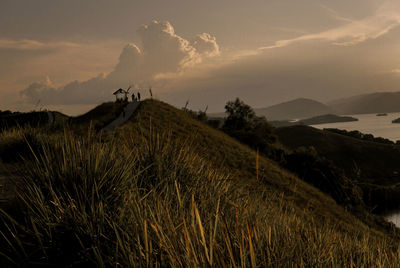 Scenic view of field against sky during sunset