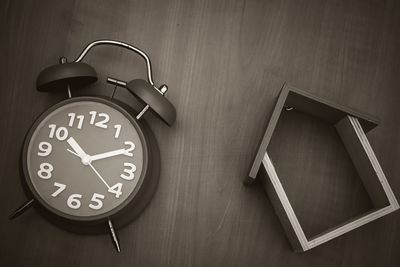 Close-up of clock on table