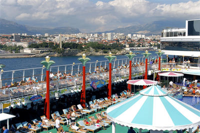 High angle view of boats in sea against buildings