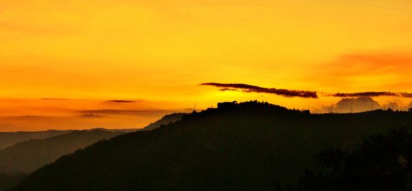 Scenic view of mountains at sunset