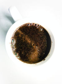 High angle view of coffee cup on table