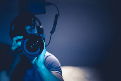 Close-up of man holding camera