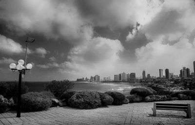 Cityscape against cloudy sky