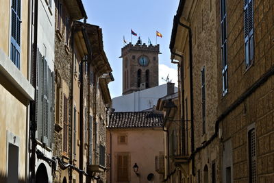 Low angle view of buildings against sky in city