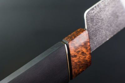 Close-up of usb stick against black background