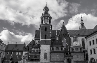 Low angle view of wawel castle against cloudy sky