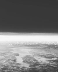 Scenic view of sea against sky during winter