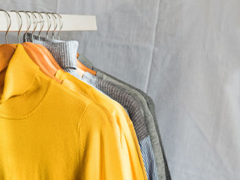 Close-up of clothes hanging on rack