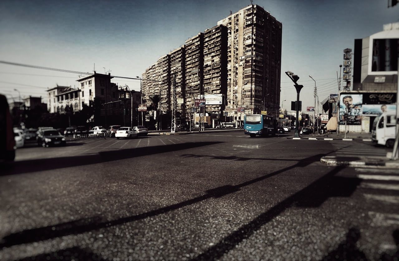 CITY STREET AGAINST SKY