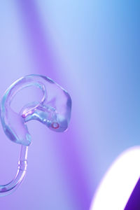 Close-up of water drop against blue background