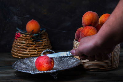 Midsection of person holding fruits