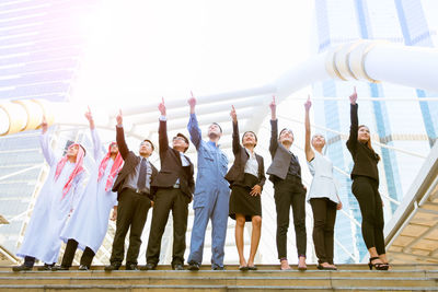 Group of people standing against the sky