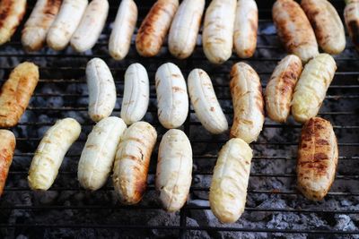 High angle view of meat on barbecue grill