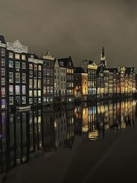 Illuminated buildings in city at night