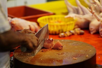 Close-up of hand holding meat