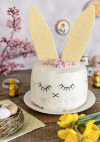 Easter cake decorated as a bunny. holiday, food, desert, spring, easter eggs, flowers.