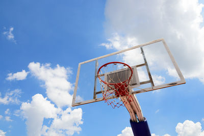 Low angle view of basketball hoop against sky