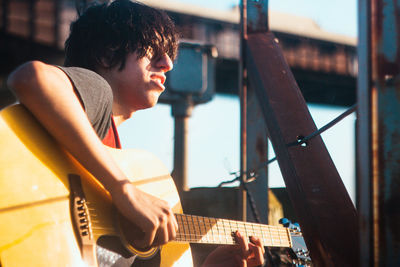 Young man playing guitar