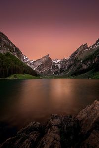 Scenic view of lake against sky during sunset