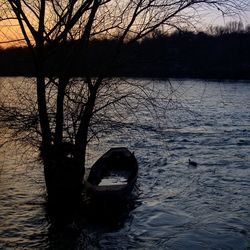 Scenic view of river at sunset