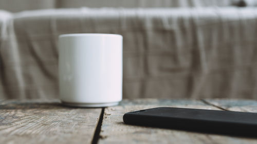 Close-up of coffee cup on table