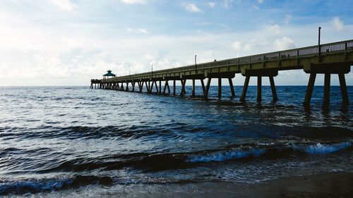 Pier over sea against sky