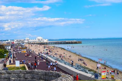 High angle view of people by sea against sky