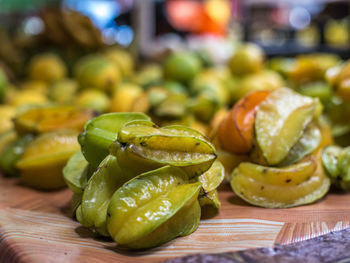 Close-up of green fruits on table