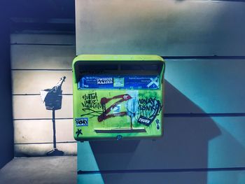 Close-up of information sign on wall