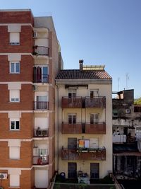 Buildings in city against sky