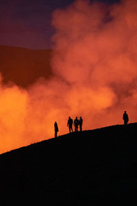 Silhouette people at sunset