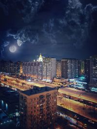 High angle view of illuminated cityscape against sky