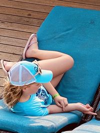 High angle view of baby sitting on swimming pool