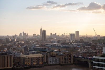 Cityscape against sky during sunset