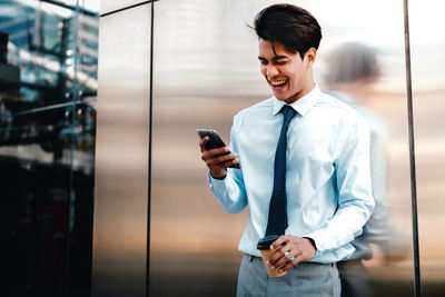 Young man using mobile phone