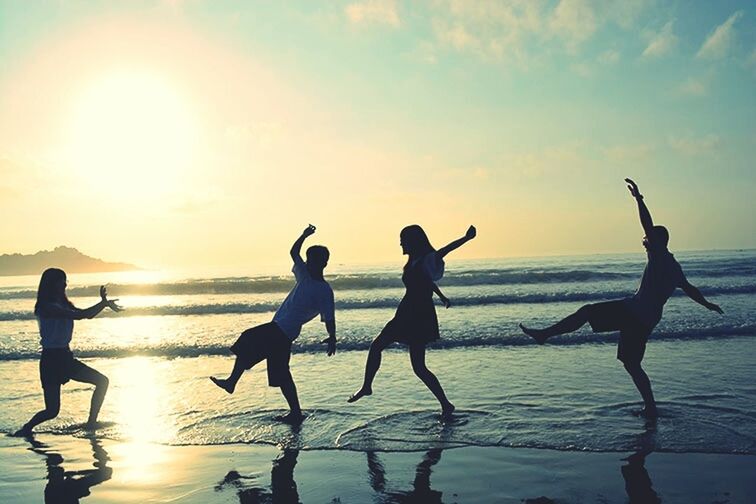 water, sea, silhouette, beach, sunset, horizon over water, sun, leisure activity, enjoyment, lifestyles, shore, sky, men, fun, sunlight, reflection, vacations, togetherness, nature