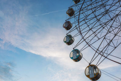 Low angle view of ferris wheel against sky