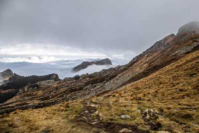 Mountain peaks in the middle of clouds during autumn, monte roccabiasca, lagdei, parma, italy