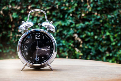 Close-up of clock on table