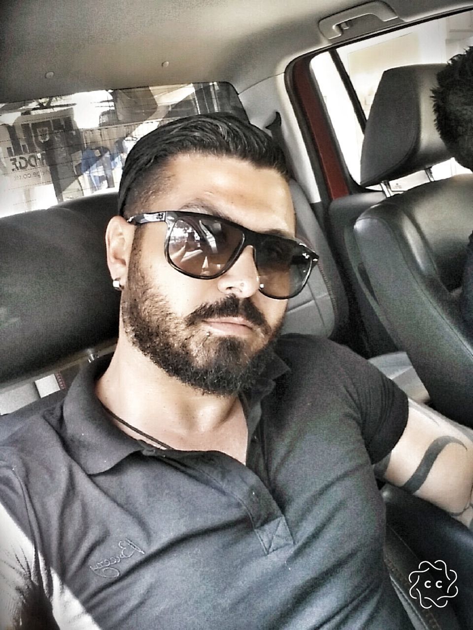 sunglasses, car, vehicle interior, transportation, car interior, land vehicle, mode of transport, eyeglasses, one person, young adult, real people, looking at camera, young men, beard, sitting, glasses, lifestyles, portrait, vehicle seat, day, outdoors, people