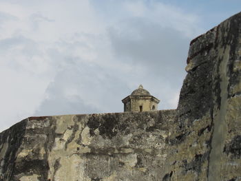 Low angle view of old building against sky