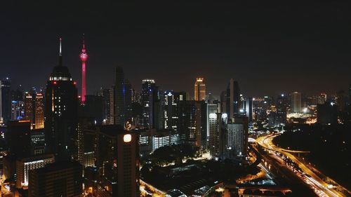 High angle view of skyscrapers lit up at night