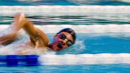 Portrait of man swimming in pool