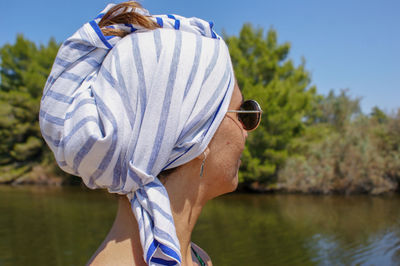 Close-up of woman with towel on head